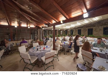 DUBROVNIK, CROATIA - MAY 27, 2014: Guests and waitress in Proto restaurant, one of Dubrovnik's best known places for fish specialities.