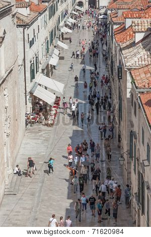 DUBROVNIK, CROATIA - MAY 26, 2014: Crowds walking down Stradun in the old town Dubrovnik, Croatia.