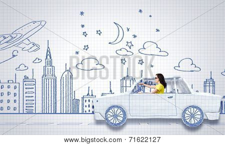 Young woman riding car made of list of paper