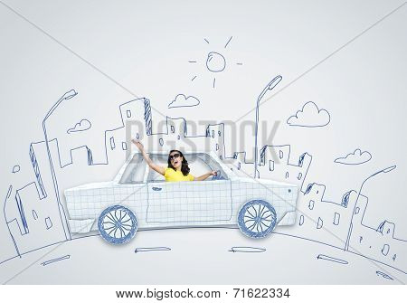 Young woman riding car made of list of paper
