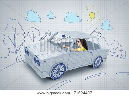 Young woman riding car made of list of paper