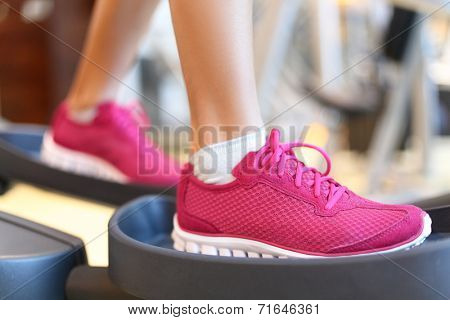 . Closeup of women feet during exercise training on moonwalker.