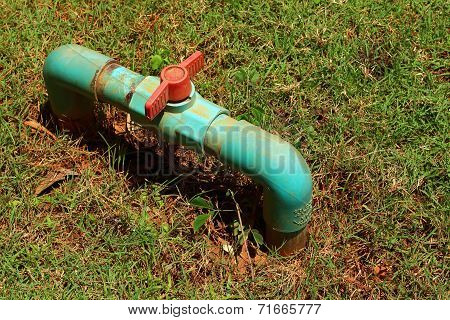 Water Valve On A Grass Background