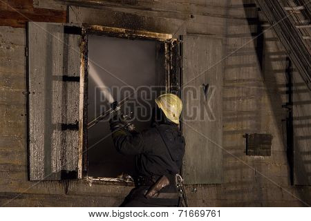 Firefighters extinguishing fire in building