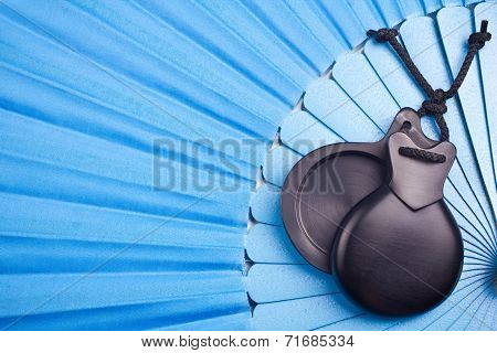 Blue Spanish flamenco fan with black castanets