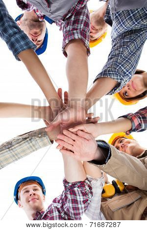 Construction Worker Stacking Hands