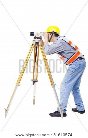 Surveyor Worker Making Measurement  And Isolated On White