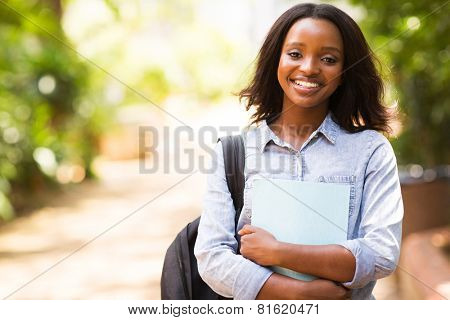 portrait of african college student holding a book
