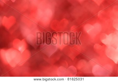 Abstract red background with heart-shaped boke