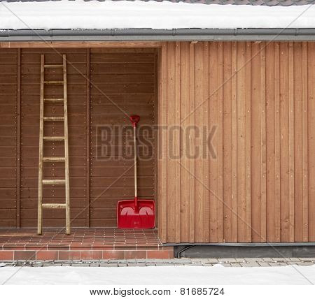 Red shovel and ladder