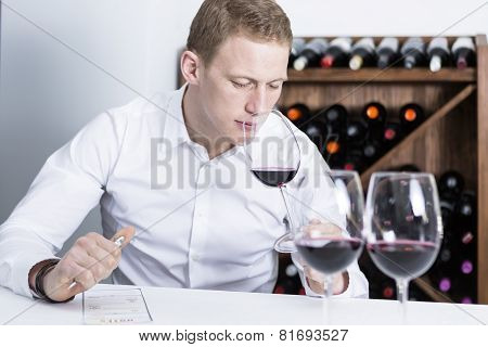 Winemaker Smelling A Red Wineglass.