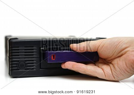 System Administrator Inserting A Backup Tape In A Backup Unit