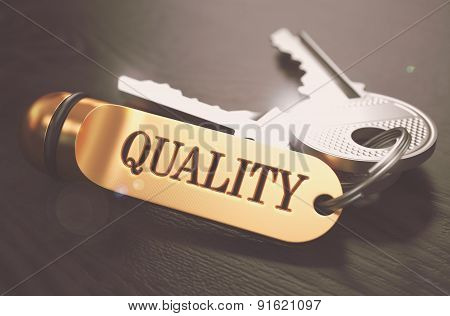 Keys to Quality. Concept on Golden Keychain.