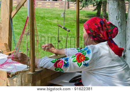 Belorussian Craftswoman Works At The Loom