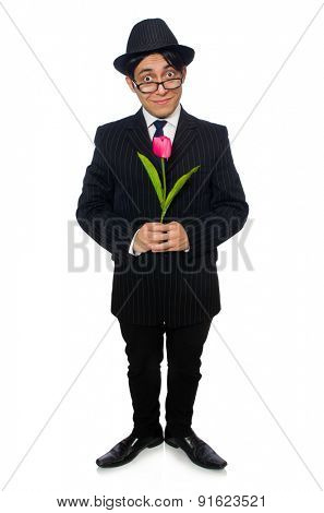 Young man in black costume with flower isolated on white