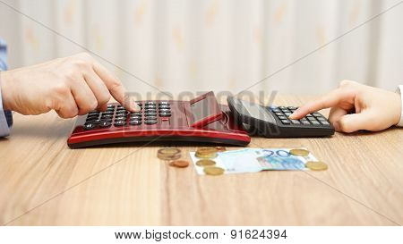 Man And Woman Calculating Hot To Spli T Little Money, Concept Of Poverty