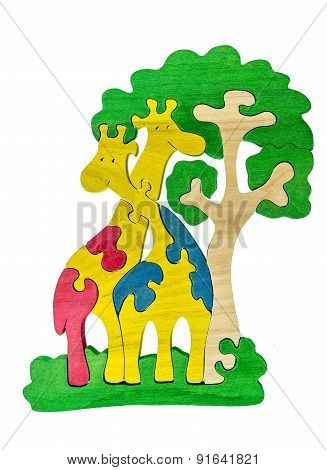 Colorful wooden puzzle in giraffes shape on isolated background