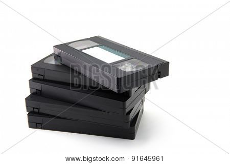 VHS Video cassette tapes stacked, isolated on white. blank label.