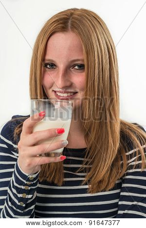 young woman drinking a glass of milk