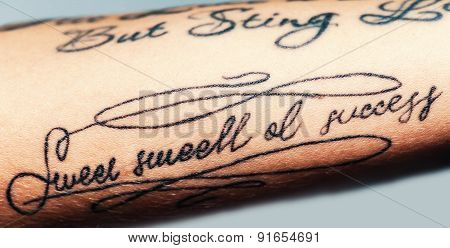 Image Of Tattooed Female Arm. Close-up Portrait Of A Tattooed Young Girl. Text Tattoo