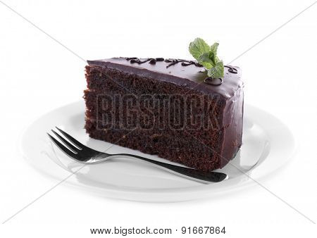 Piece of chocolate cake with mint isolated on white