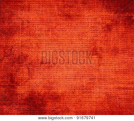 Grunge background of coquelicot burlap texture