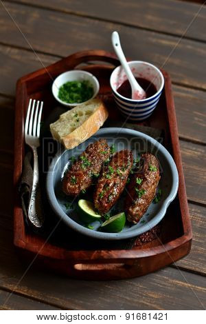 Kebabs On Wooden Tray With Cranberry Sauce