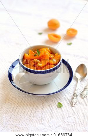 Apricot Jam In A Vintage Cup On A Light Surface