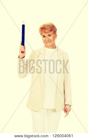 Smile elderly woman pointing up with hege pen