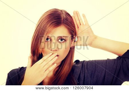 Shocked teenage woman overhears conversation
