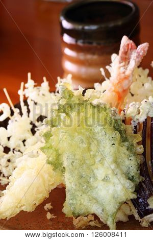 Japanese tempura set consisting of shrimp egg plant carrot and shiso leaf