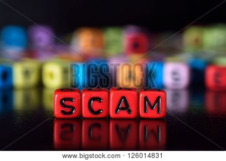 Scam on red dice word with reflection