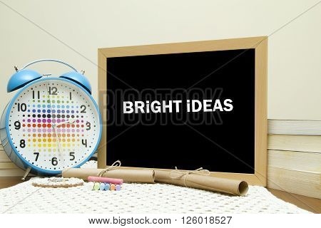Bright ideas message written on a blackboard
