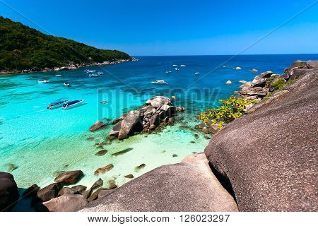 tropical bay with round stones and transparent turquoise water (Similansky islands).