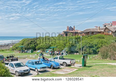 JEFFREYS BAY SOUTH AFRICA - FEBRUARY 28 2016: Unidentified tourists relaxing at Lower Point in Jeffreys Bay in the Eastern Cape Province of South Africa