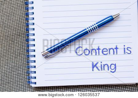 Content is king text concept write on notebook