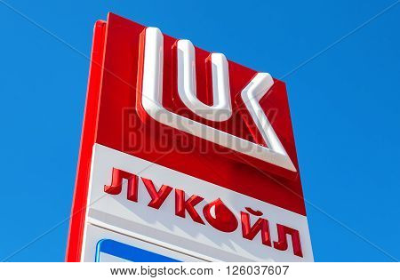 SAMARA RUSSIA - APRIL 16 2016: The emblem of the oil company Lukoil against the blue sky background. Lukoil is one of the largest russian oil companies
