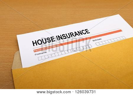 House Insurance application form on brown envelope