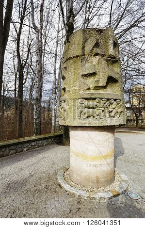 ZAKOPANE POLAND - MARCH 06 2016: Monument to Mountain Rescuers is made of stone appear scenes of mountain rescuers in action. It is the work of Hasior sculptor and painter and was unveiled in 1959