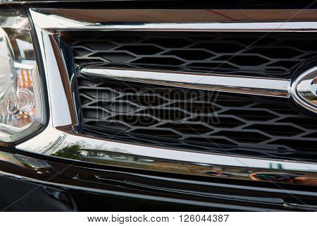 The car headlights. Exterior detail. Shallow dof