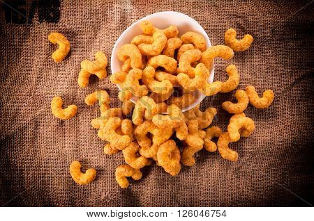 Puff children snacks from above on rustic background