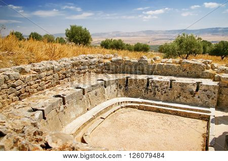 Ancient public toilet. Dougga Roman Ruins. Unesco World Heritage Site in Tunisia.