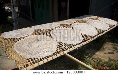 making, drying ricepaper on the bamboo net in vietnam, traditional food
** Note: Soft Focus at 100%, best at smaller sizes