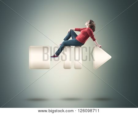 Beautiful girl sitting on music buttons .