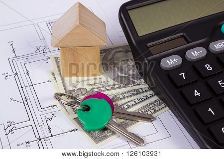 House shape made of wooden blocks home keys currencies dollar and calculator on electrical construction drawings of house calculation of cost building house