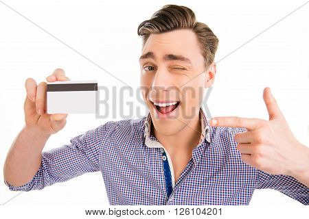 Attractive Cheerful Young Man Pointing On Bank Card