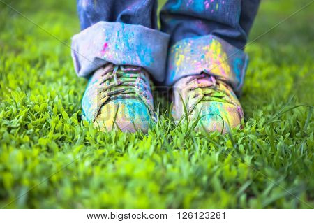 Bright dust on Vintage colorful shoes on green grass