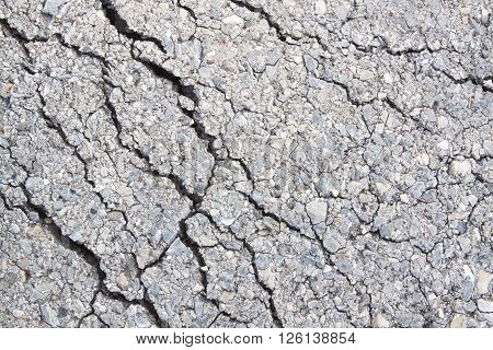 Macro Closeup On Concrete Asphalt Cracks On The Road.