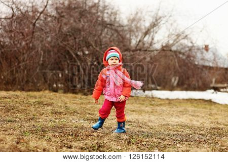 The Little children playing in the street.