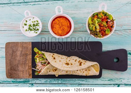 Tortilla with pulled pork, fresh vegetables
